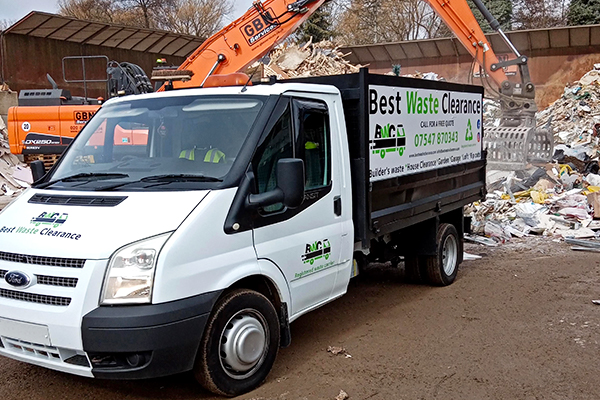 Best Waste Clearance's truck at a commercial waste dump.